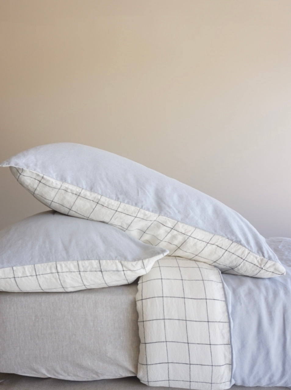 Simple Linen Co. 100% French flax linen double sided duvet cover set Alice in Black Grid and Mist colour block, paired with Nature sheet, sustainably packaged in reusable linen drawstring bag, stonewashed for softness and breathable year-round comfort.