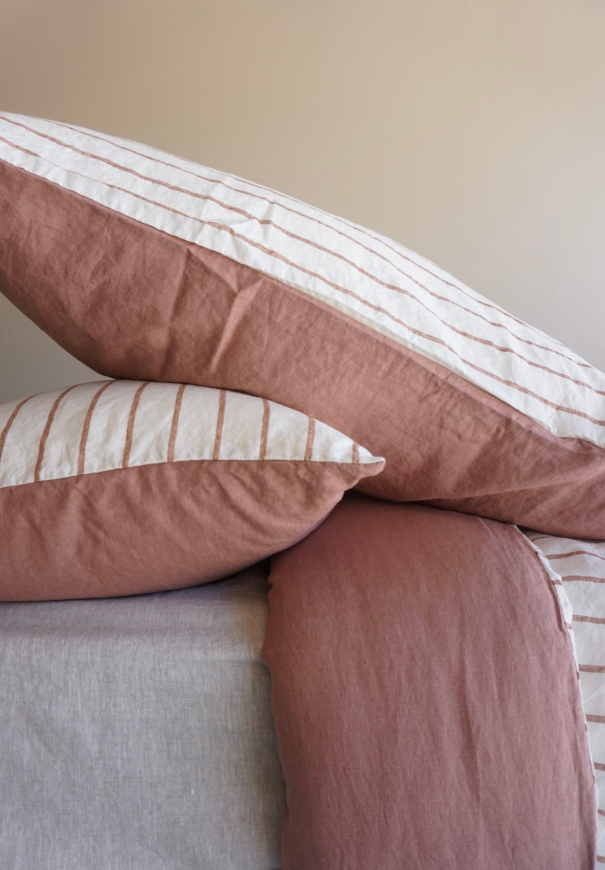 Simple Linen Co. 100% French flax linen double sided duvet cover set Beatrice in  Ginger Wide Cross Stripe and Lotus Blush Pink colour block, paired with Nature sheet, sustainably packaged in reusable linen drawstring bag, stonewashed for softness and breathable year-round comfort.