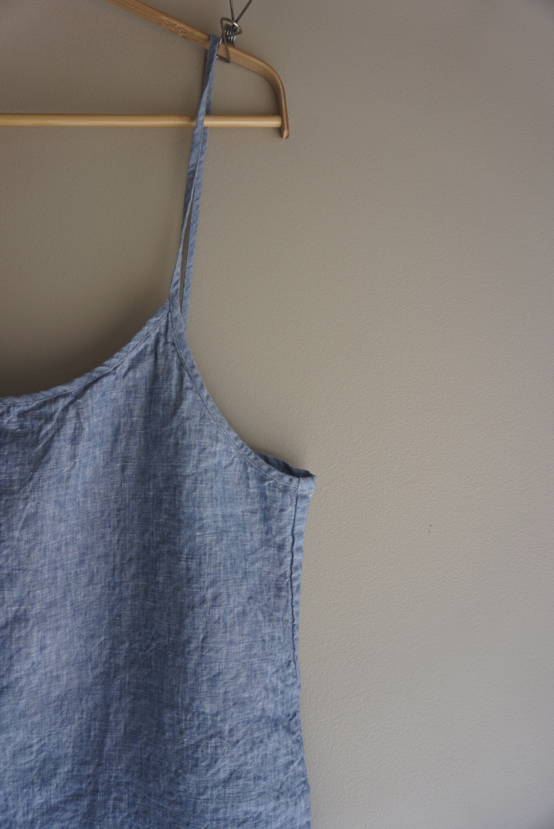A close up detailed view of Simple Linen Co's Light denim 100% French flax linen day to night Slip dress.