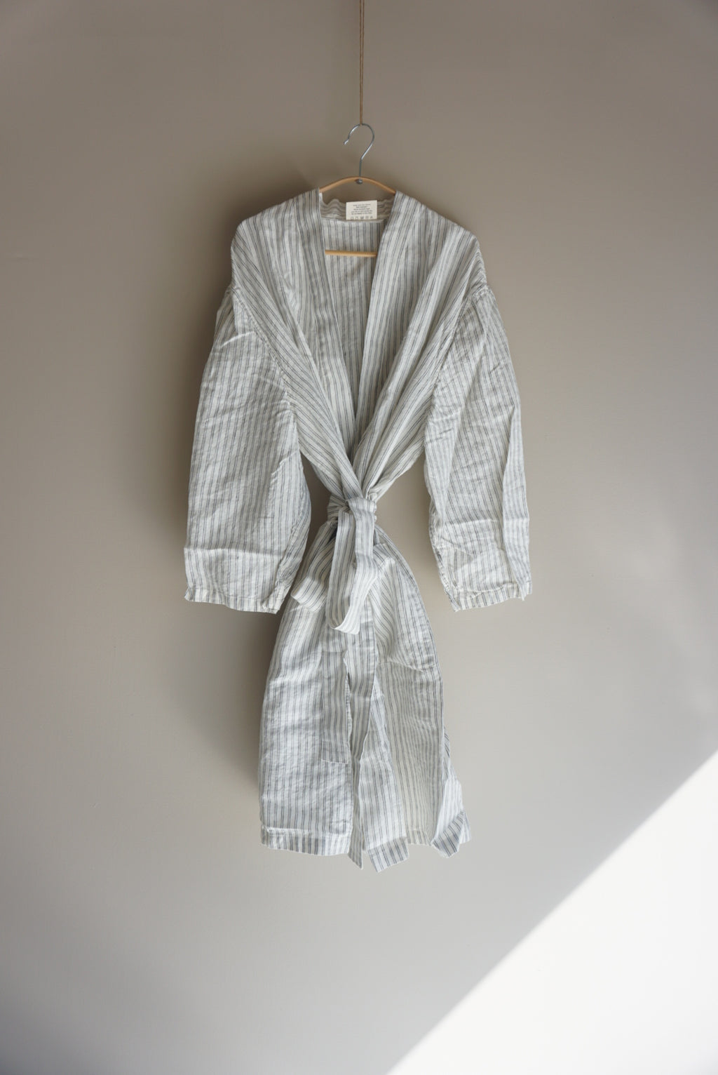 Simple Linen Co. Full view of hanging dressing gown in Double Pinstripe made from 100% French Flax Linen.