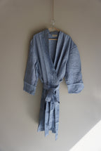 Simple Linen Co. Full view of hanging 100% French Flax Linen dressing gown in Light Denim.