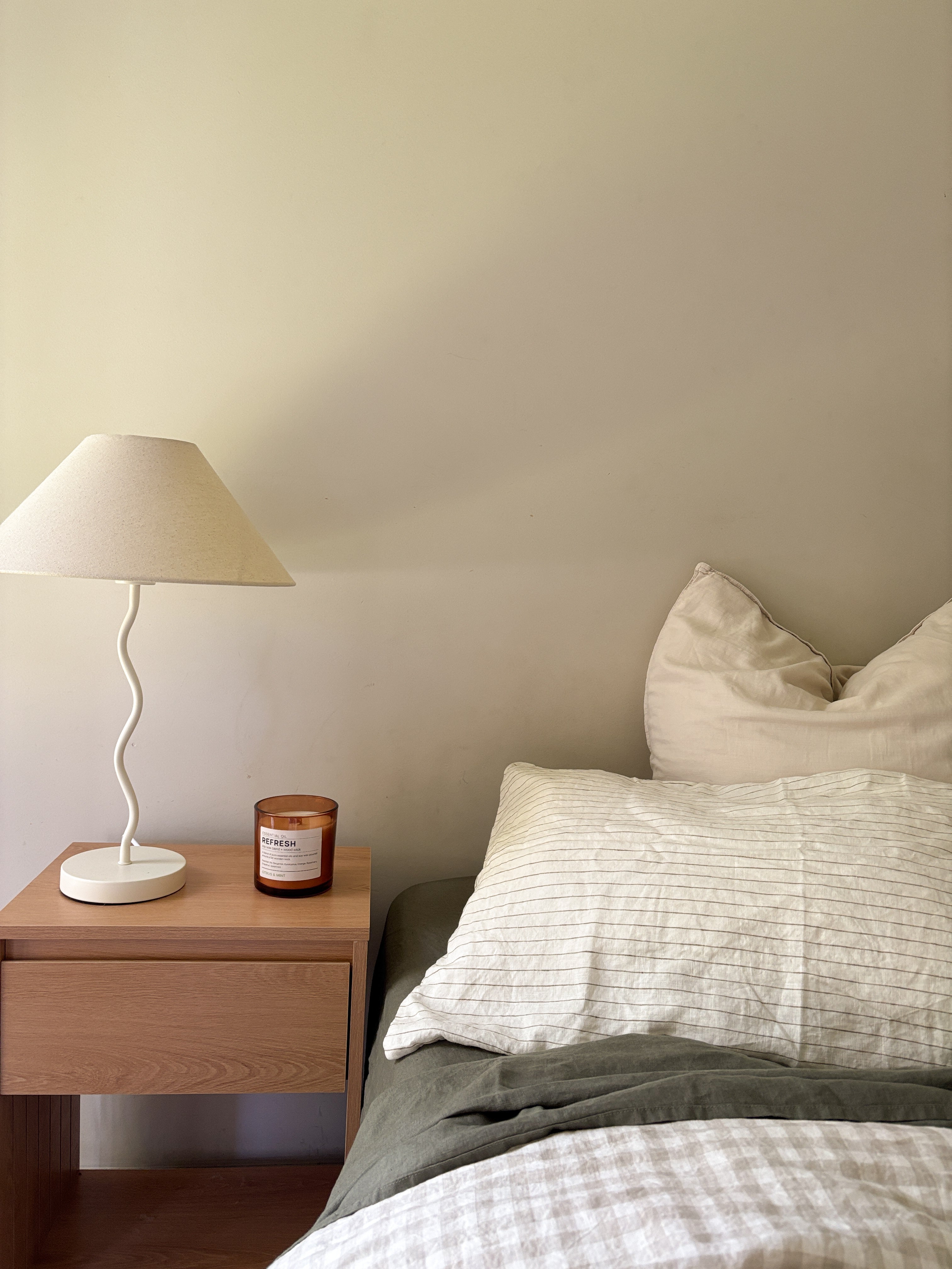 Simple Linen Co. 100% French flax linen double sided duvet cover Elowyn in Olive pinstripe and dove grey gingham, paired with Khaki sheet set in a simple minimalistic bedroom. Stonewashed for softness and breathable year-round comfort.