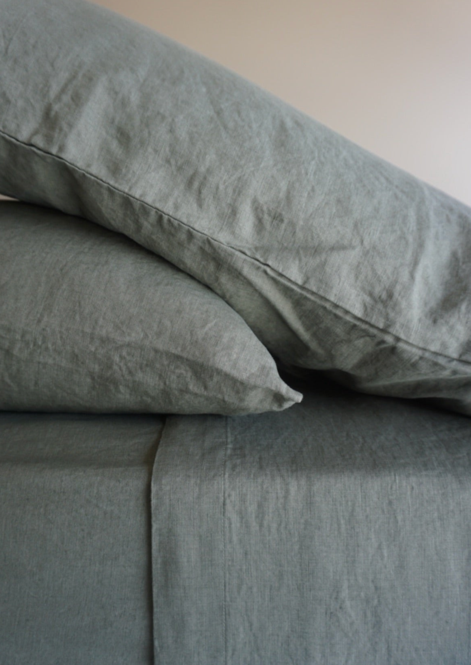 Simple Linen Co. 100% French flax linen sheet set in Khaki, stonewashed for added softness and durability, sheet set includes pillowcases, flat sheet and fitted sheet, sustainably packaged in reusable linen drawstring bag.