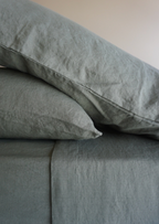 Simple Linen Co. 100% French flax linen sheet set in Khaki, stonewashed for added softness and durability, sheet set includes pillowcases, flat sheet and fitted sheet, sustainably packaged in reusable linen drawstring bag.
