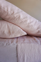 Simple Linen Co. 100% French flax linen sheet set in Light Pink, stonewashed for added softness and durability, sheet set includes pillowcase/s, flat sheet and fitted sheet, sustainably packaged in reusable linen drawstring bag.