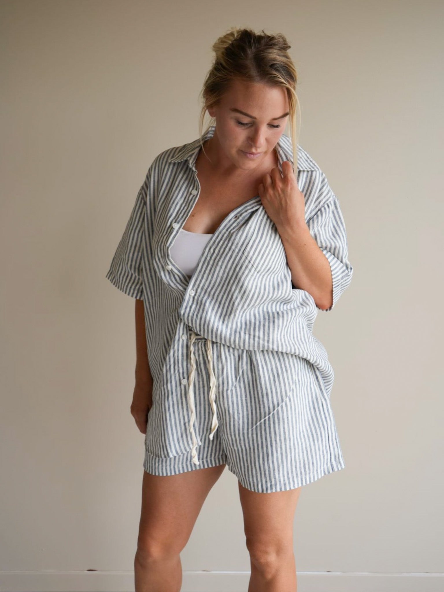 Model wearing S/M Marine Stripe Day to Nightwear short sleeve set by Simple Linen Co in a studio setting.