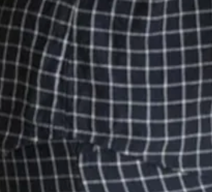 A close up product image Simple Linen Co's Navy Grid 100% French flax linen material.