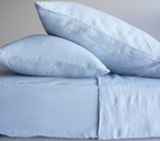 Simple Linen Co. 100% French flax linen sheet set in Mist, stonewashed for added softness and durability, sheet set includes pillowcases, flat sheet and fitted sheet, sustainably packaged in reusable linen drawstring bag.