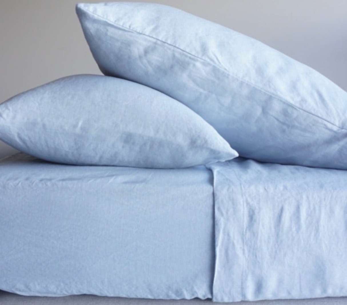 Simple Linen Co. 100% French flax linen sheet set in Mist, stonewashed for added softness and durability, sheet set includes pillowcases, flat sheet and fitted sheet, sustainably packaged in reusable linen drawstring bag.