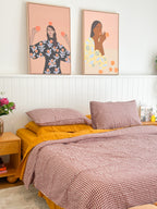 Simple Linen Co. 100% French flax linen duvet cover Margot in Red Mulberry Gingham, paired with Mustard sheet set, in a colourful bedroom setting.  Stonewashed for softness and breathable year-round comfort.