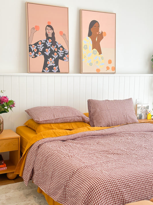 Simple Linen Co. 100% French flax linen duvet cover Margot in Red Mulberry Gingham, paired with Mustard sheet set, in a colourful bedroom setting.  Stonewashed for softness and breathable year-round comfort.