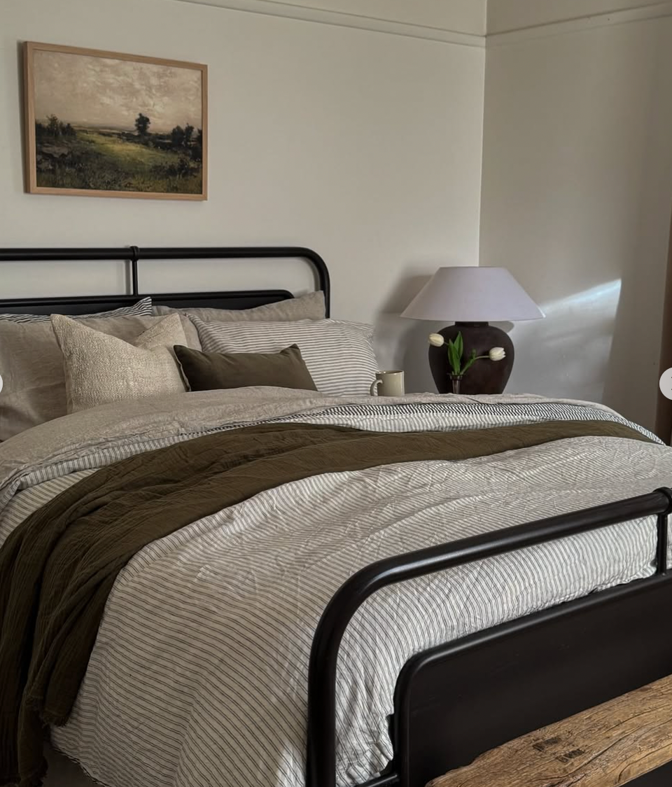 Simple Linen Co. Earthy hues bedroom view of 100% French flax linen sheet set in Nature, featured with Ida Double Pinstripe and Charcoal Stripe double sided duvet cover set.