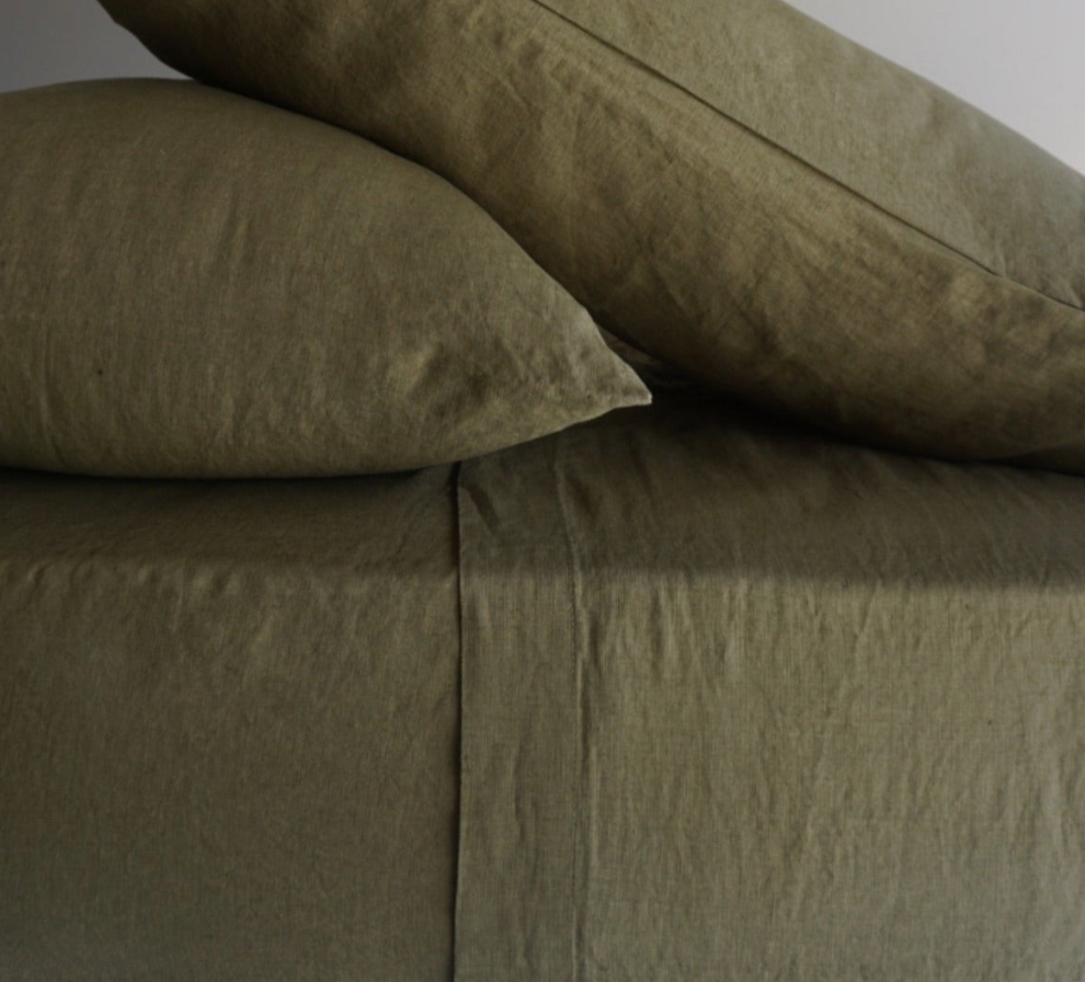 Simple Linen Co. 100% French flax linen sheet set in Olive, stonewashed for added softness and durability, sheet set includes pillowcases, flat sheet and fitted sheet, sustainably packaged in reusable linen drawstring bag.